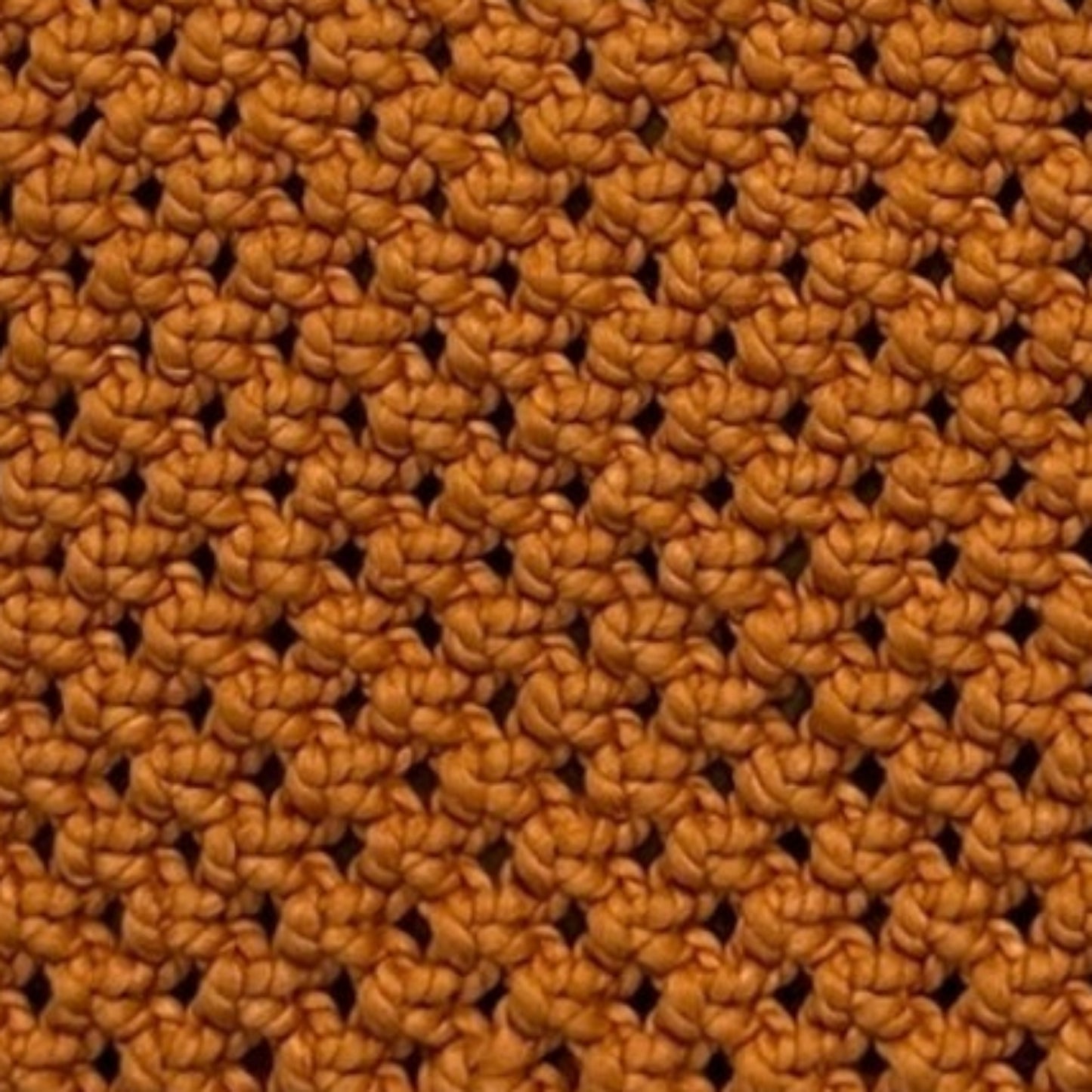Close-up detail of burnt orange woven macrame texture, premium handcrafted stitching and structure