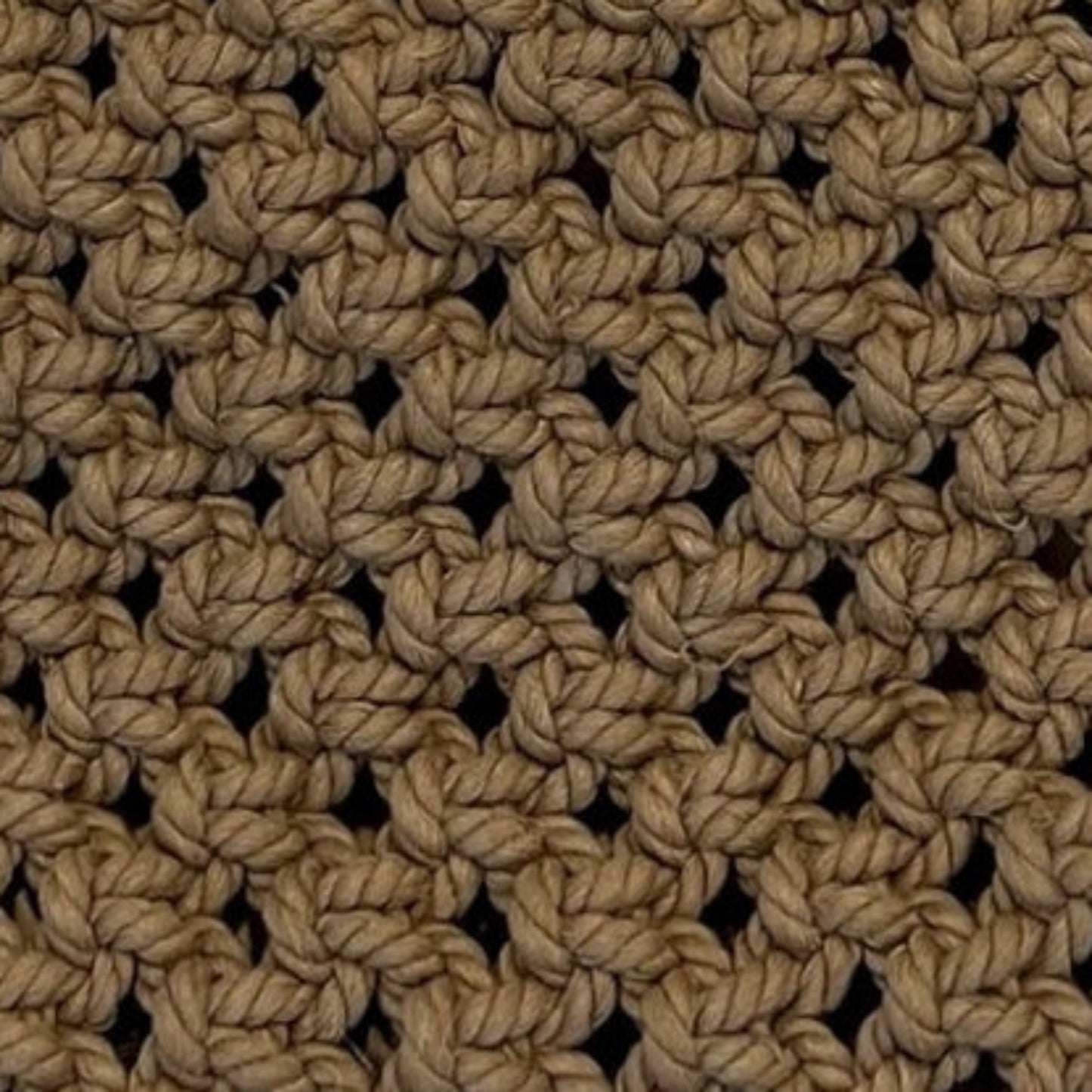 Close-up detail of caramel brown macrame bag highlighting intricate handwoven texture and craftsmanship