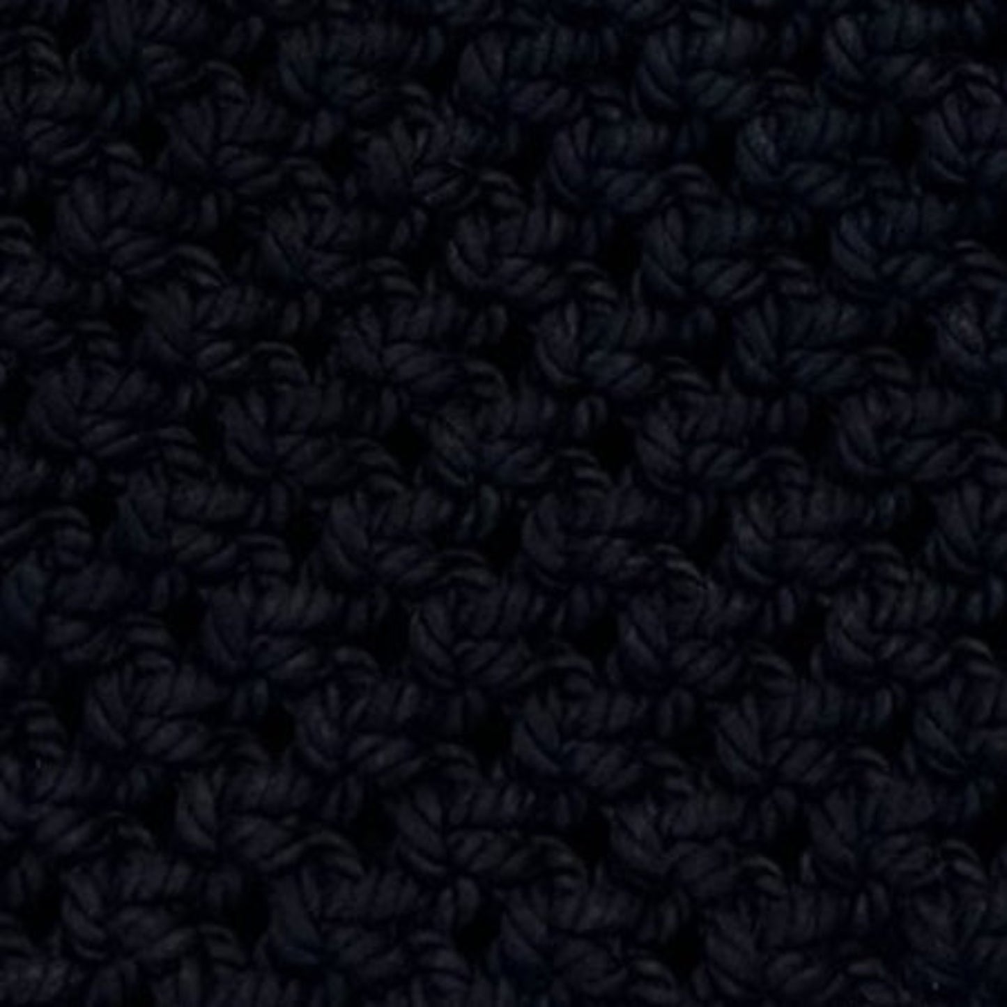 Close-up of black macrame bag texture, handcrafted woven pattern detail, premium cotton rope craftsmanship