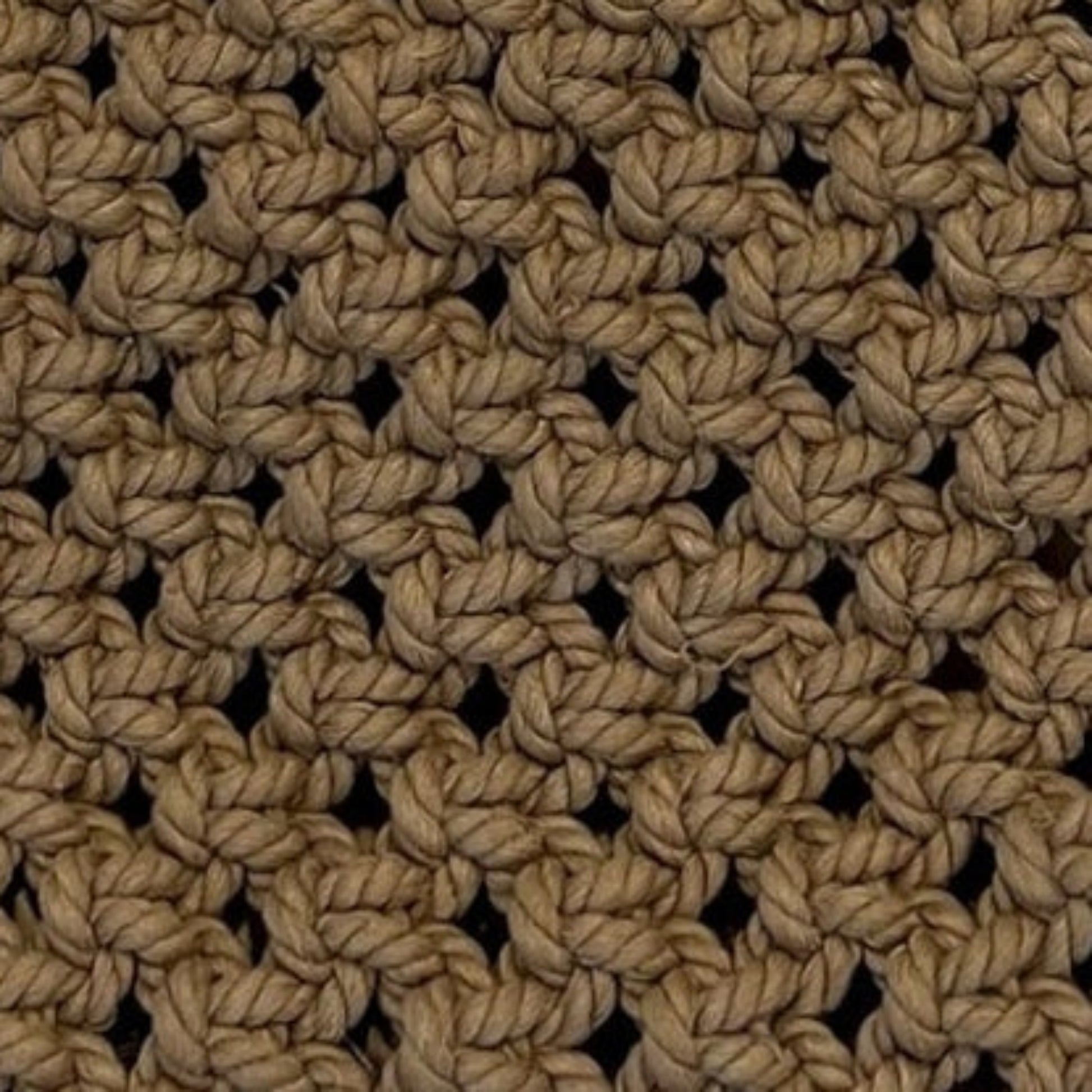 Close-up detail of caramel brown macrame bag highlighting intricate handwoven texture and craftsmanship