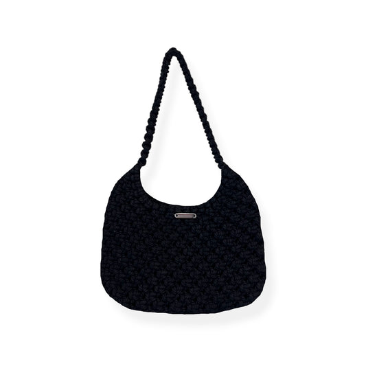 Black handmade macrame shoulder bag with minimalist crescent silhouette, luxury woven texture, front view on neutral background