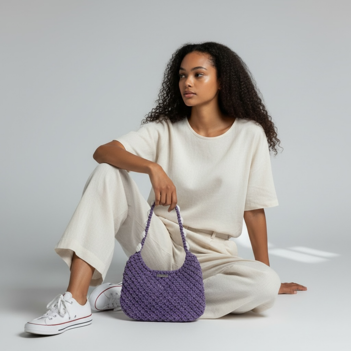 Dusty lavender crochet bag styled with white outfit, soft boho luxury handbag look
