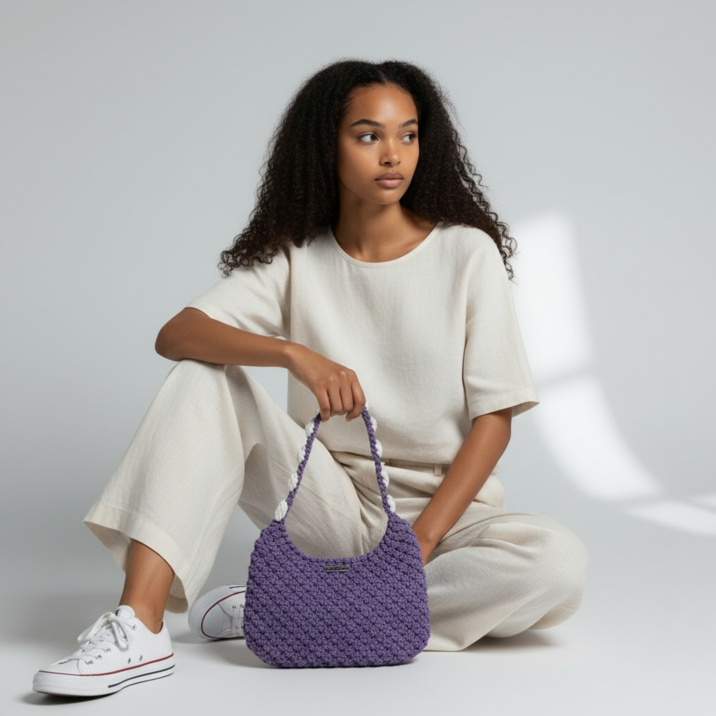 Handcrafted crochet shoulder bag in dusty lavender, elegant everyday luxury styling
