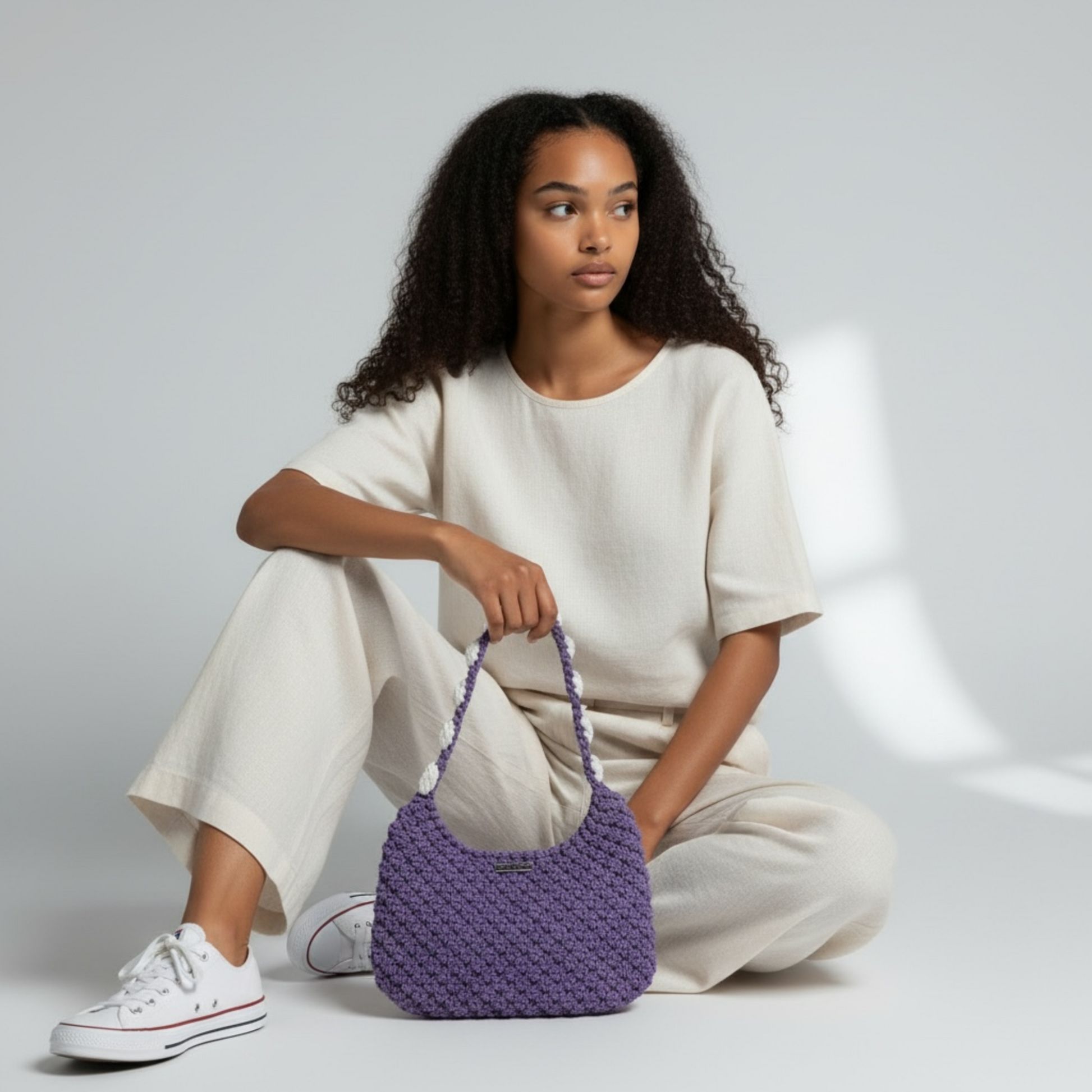Handcrafted crochet shoulder bag in dusty lavender, elegant everyday luxury styling