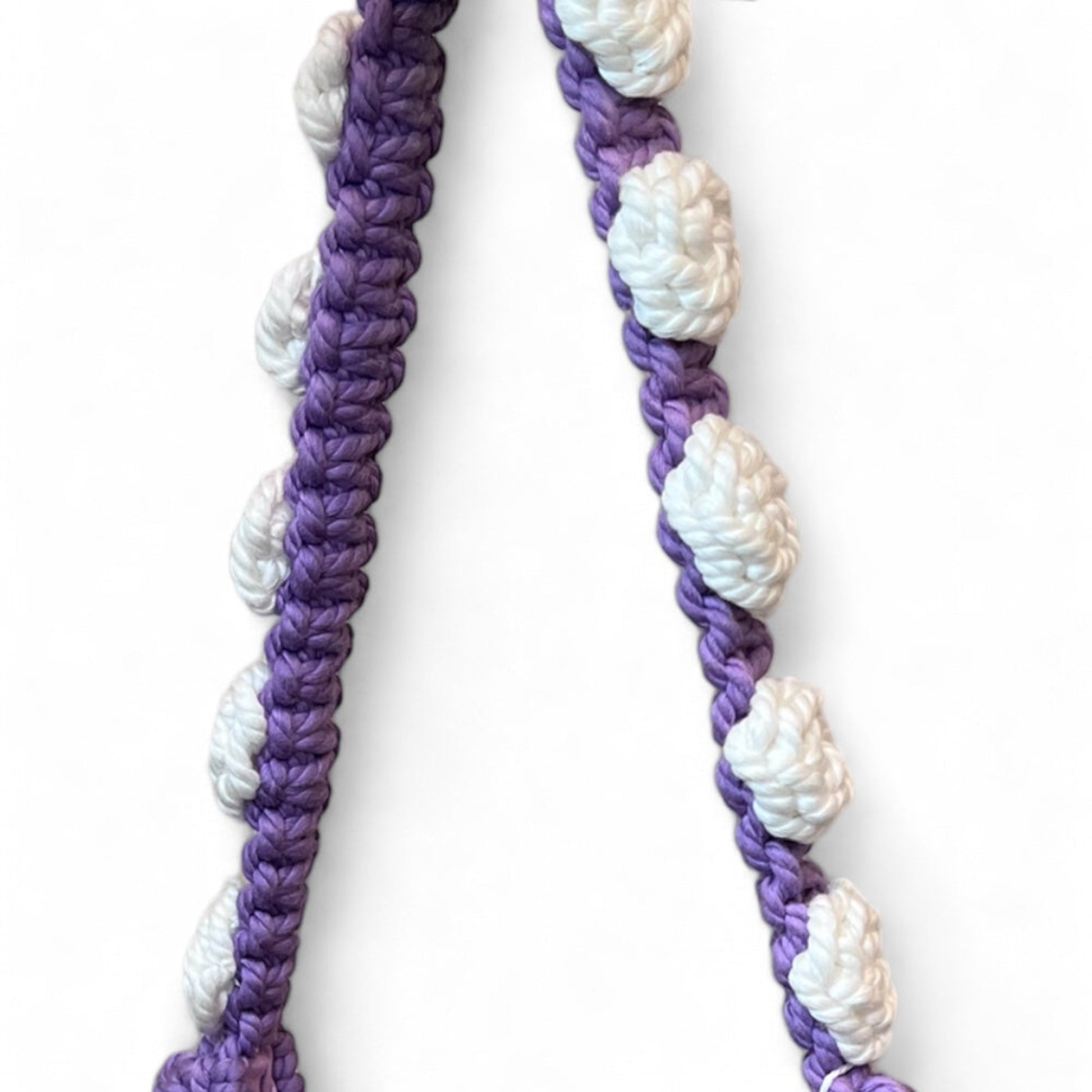 Crochet bag floral strap detail in dusty lavender and white, handcrafted texture close-up