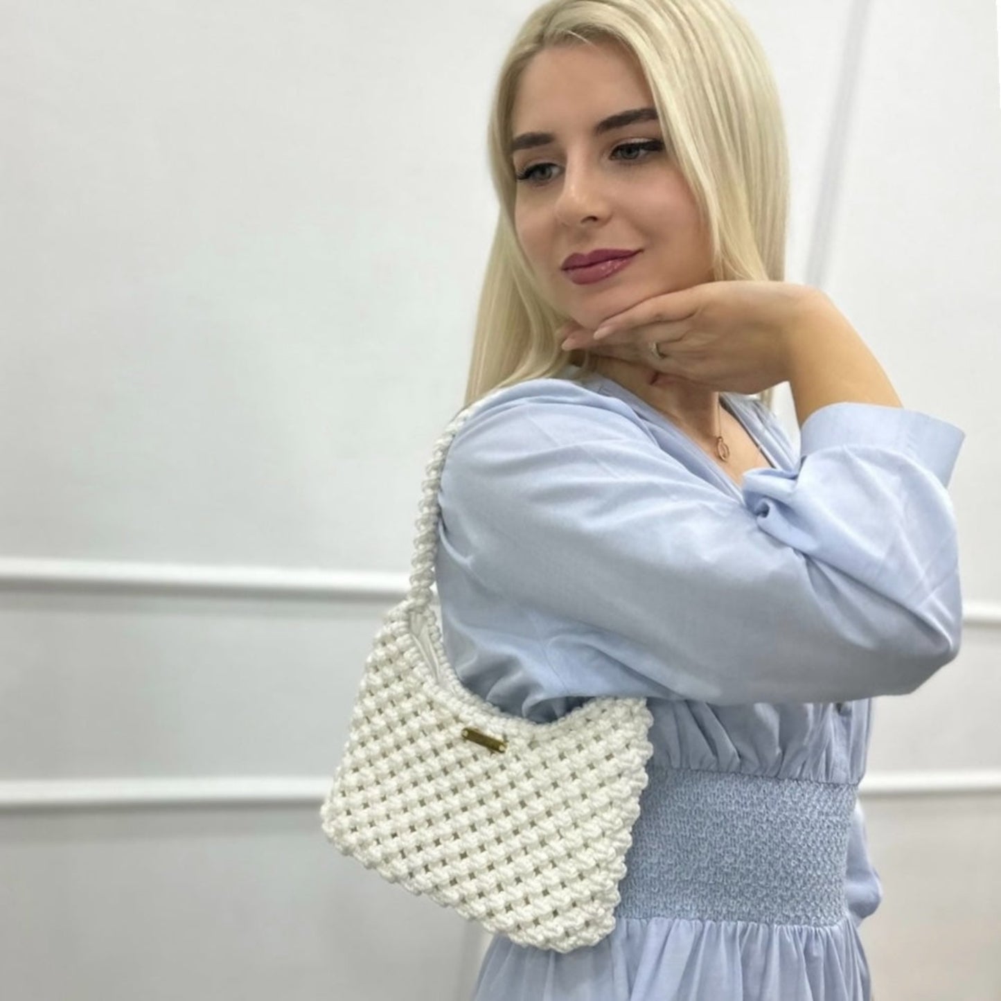 Ivory white handmade macrame bag styled with soft feminine look, modern aesthetic