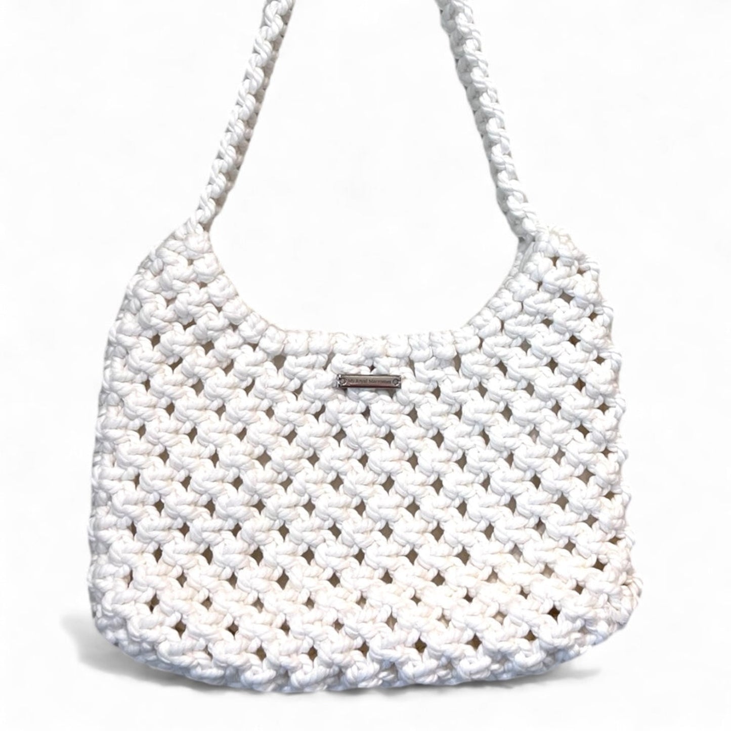 Close-up of ivory white macrame bag texture highlighting handcrafted detail and premium finish
