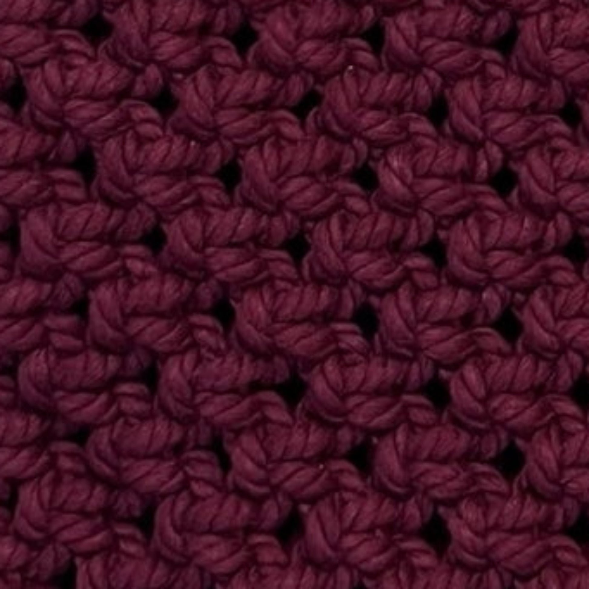 Close-up detail of merlot plum macrame bag showcasing intricate handwoven texture and craftsmanship