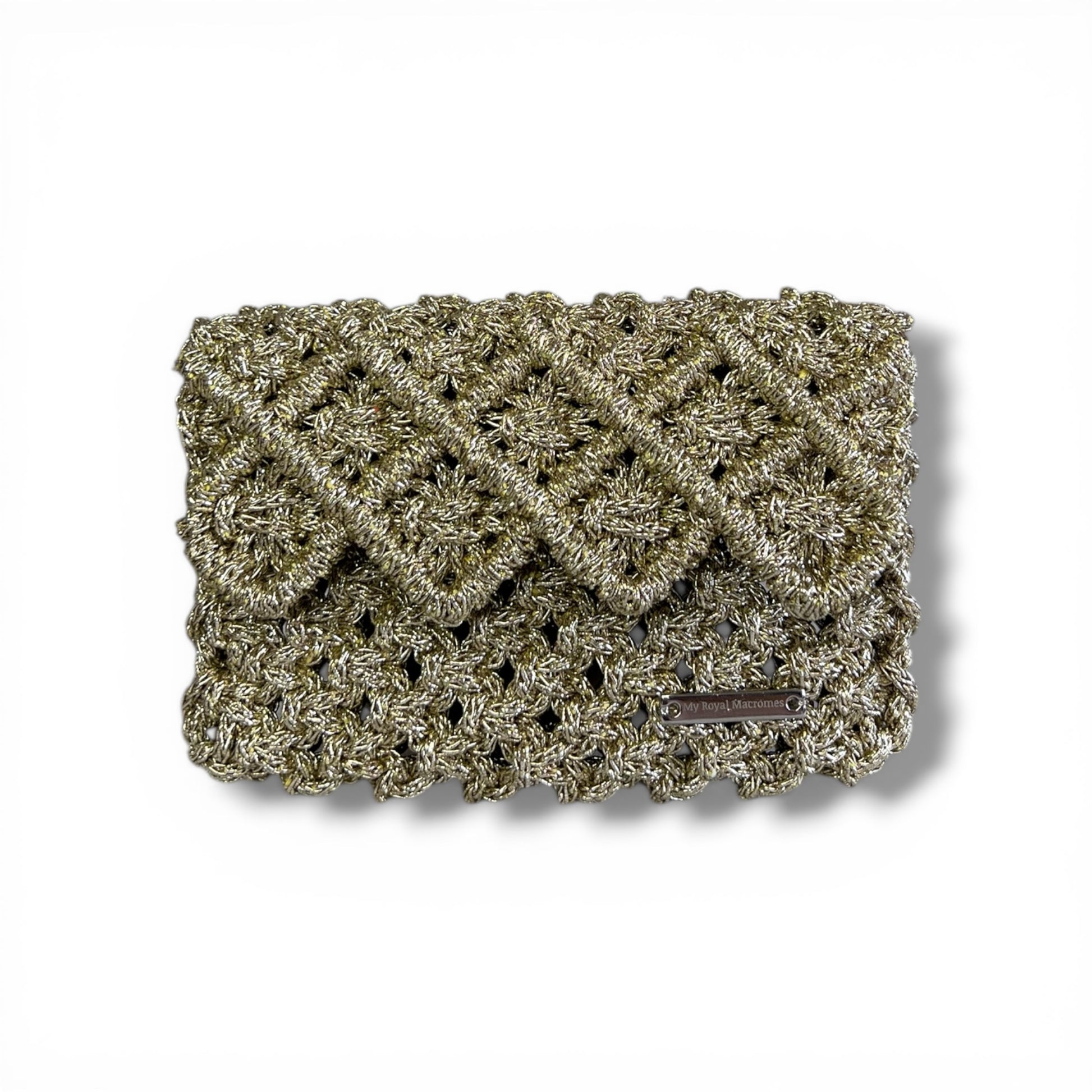 Effortlessly refined.

From sunlit escapes to evening elegance, this handcrafted macrame mini bag is designed to elevate every moment.

A statement of texture, craftsmanship, and quiet luxury.



Details
• Handmade macrame
• Metallic gold cord
• Structured interior
• Hand strap


⸻


Size


5.1” W × 3.5” H