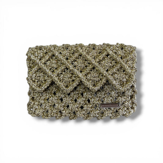 Effortlessly refined.

From sunlit escapes to evening elegance, this handcrafted macrame mini bag is designed to elevate every moment.

A statement of texture, craftsmanship, and quiet luxury.



Details
• Handmade macrame
• Metallic gold cord
• Structured interior
• Hand strap


⸻


Size


5.1” W × 3.5” H