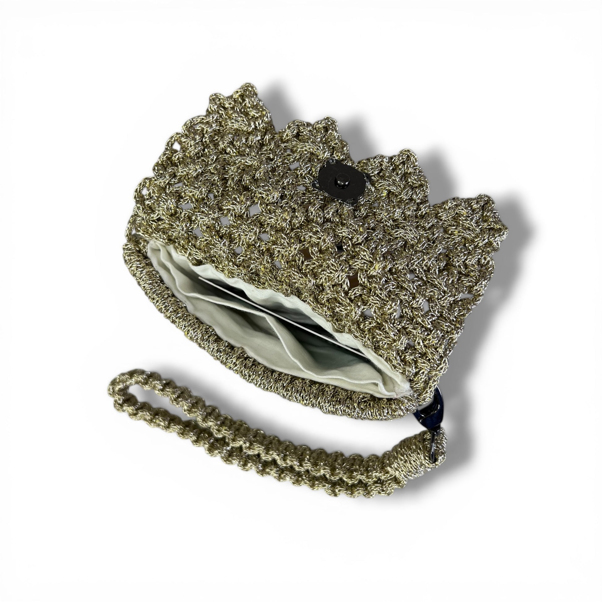 Effortlessly refined.

From sunlit escapes to evening elegance, this handcrafted macrame mini bag is designed to elevate every moment.

A statement of texture, craftsmanship, and quiet luxury.



Details
• Handmade macrame
• Metallic gold cord
• Structured interior
• Hand strap


⸻


Size


5.1” W × 3.5” H