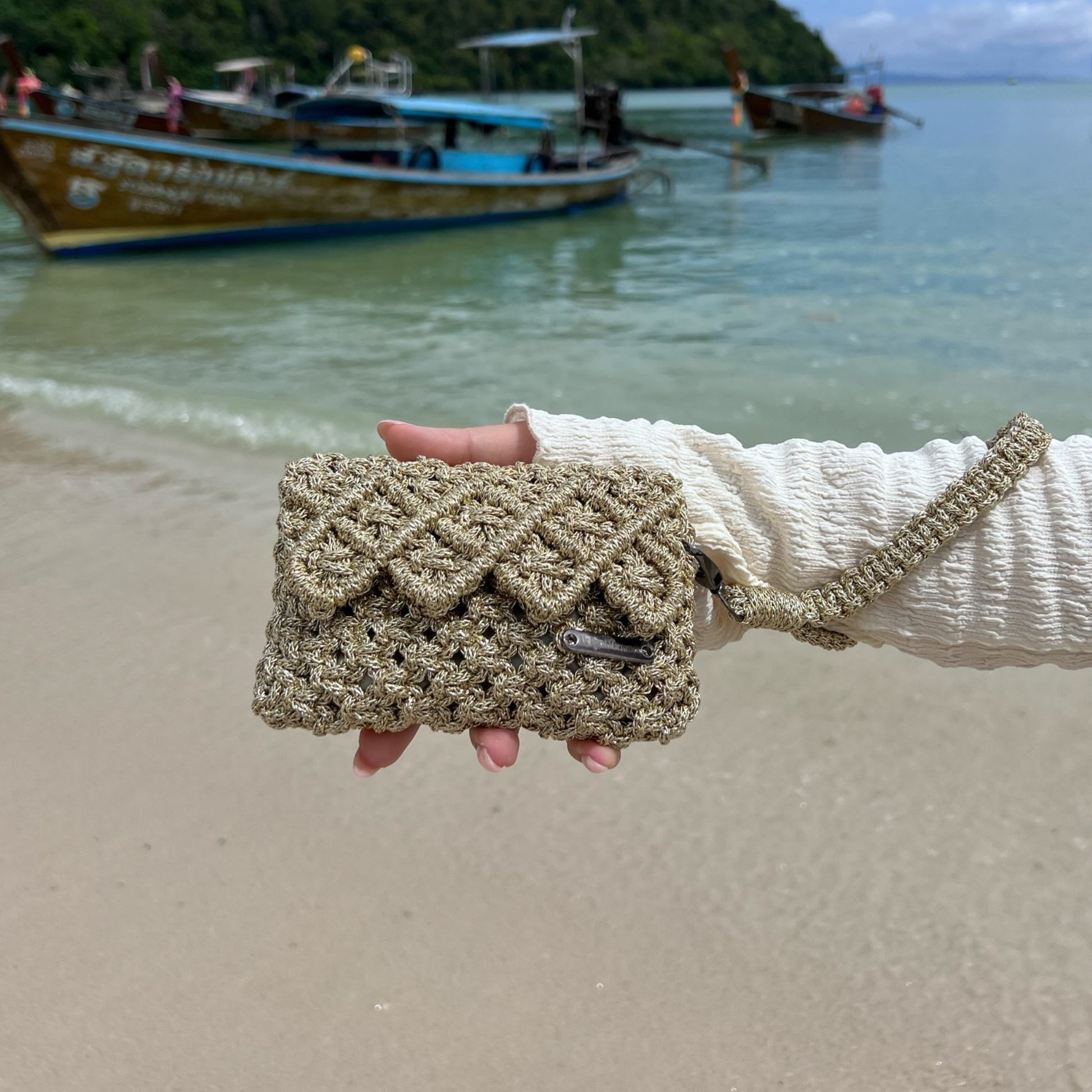 Effortlessly refined.

From sunlit escapes to evening elegance, this handcrafted macrame mini bag is designed to elevate every moment.

A statement of texture, craftsmanship, and quiet luxury.



Details
• Handmade macrame
• Metallic gold cord
• Structured interior
• Hand strap


⸻


Size


5.1” W × 3.5” H