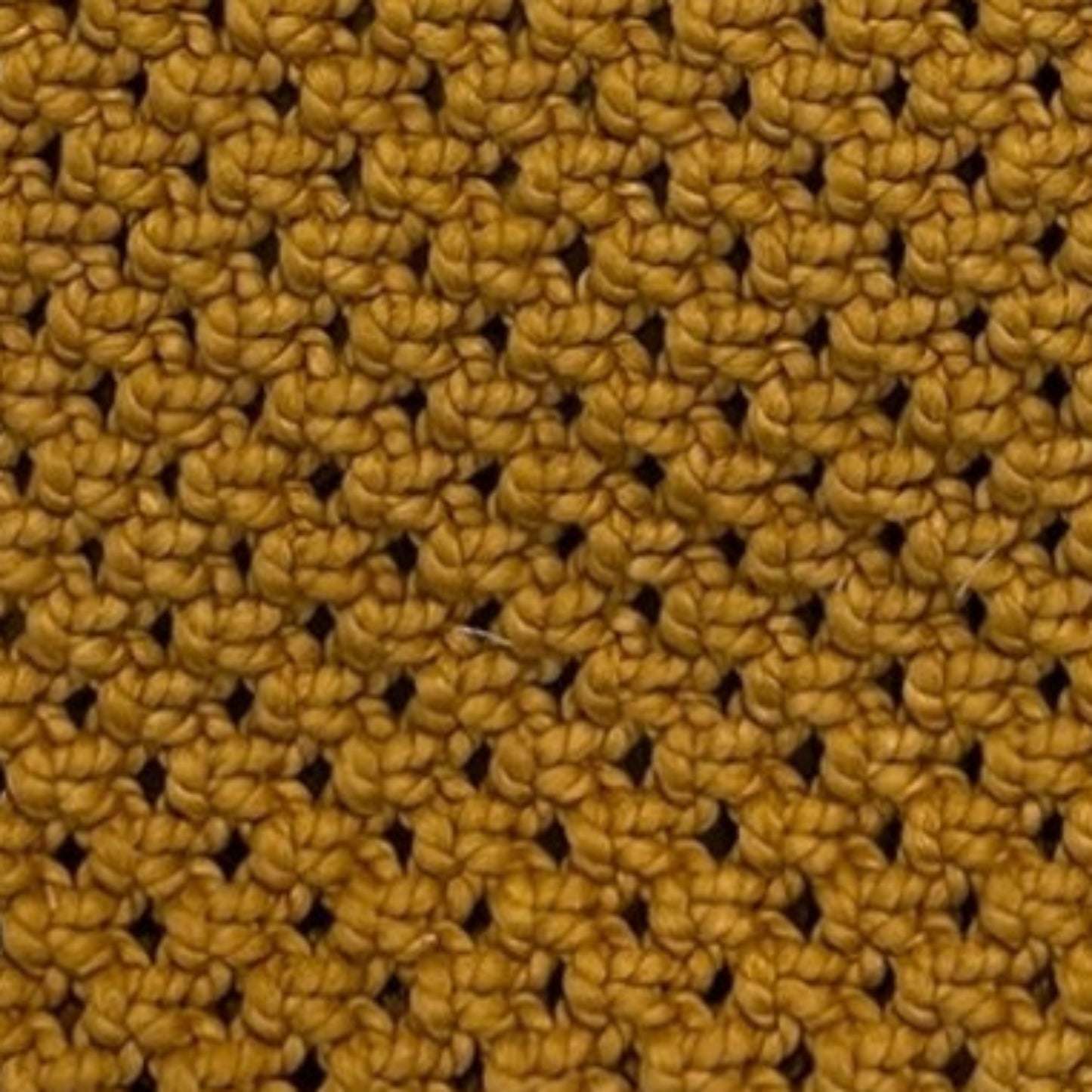 Close-up of mustard macrame bag texture showcasing handwoven craftsmanship and premium detail